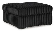 FURRY OTTOMAN IN BLACK